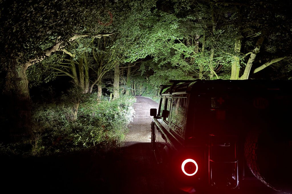 Stealth led lights shining high performance lighting down a country road at night